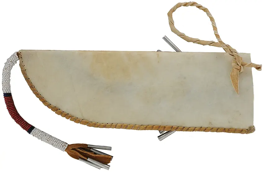 Knife with Beaded Knife Sheath,
5" blade, maple scales,
10-1/2" long by 3-1/2" wide,
leather and rawhide, tin cones