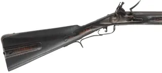 Southern Smooth Rifle,
.54 caliber smoothbore, 44" octagon-to-round barrel,
Chambers' flint lock, maple, forged iron,
used, by J. Eitnier