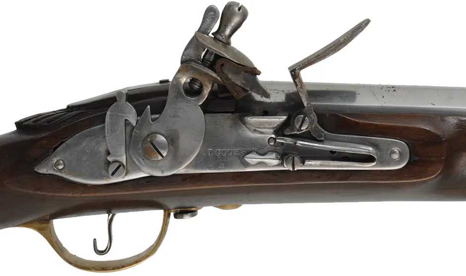 Doglock Trade Musket,
.69 caliber smoothbore, 51-1/2" octagon-to-round barrel,
teak stained as walnut, brass trim, lock marked I. Cookson,
used, made in India