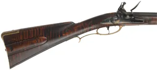 Colonial Longrifle,
.58 caliber, 43-1/2" swamped barrel, 
round faced flintlock, curly maple, unfired