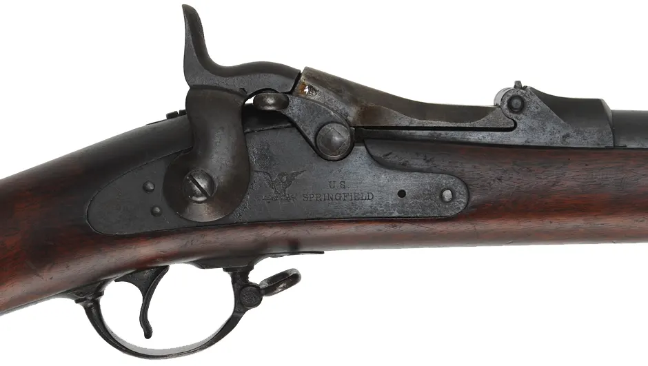 U.S. Model 1884 Springfield Trapdoor Rifle,
caliber .45-70 Gov't,  32-5/8" barrel,
walnut, iron, loose rear sight, antique