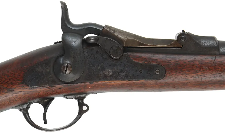U.S. Model 1884 Springfield Trapdoor Rifle,
caliber .45-70 Gov't,  32-5/8" barrel,
cut-down walnut stock, iron, dark bore, antique
