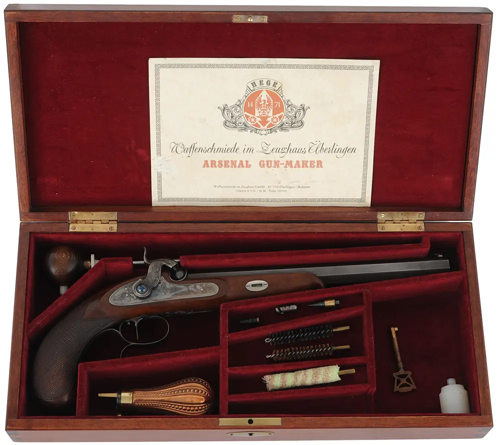 Siber Target Pistol, 
.33 caliber, 10" barrel,
percussion, checkered walnut, iron trim, 
factory range & display cases, with accessories, 
used by Hege-Germany