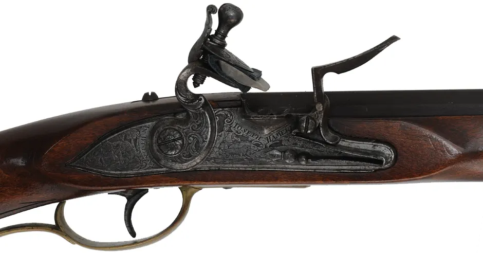 Tennessee Maid Longrifle,
.38 caliber, 41-1/4" barrel,
antique flintlock, maple, brass, extra lock,
by one of America's first replica longrifle makers,
used, signed by Royland Southgate