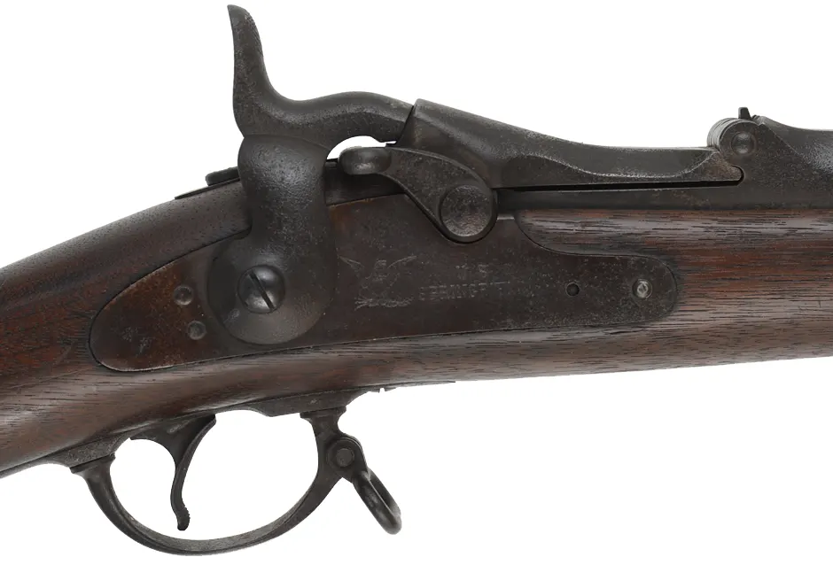 U.S. Model 1884 Springfield Trapdoor Rifle,
caliber .45-70 Gov't,  32-5/8" barrel,
walnut, iron, dark bore, repaired forend, antique
