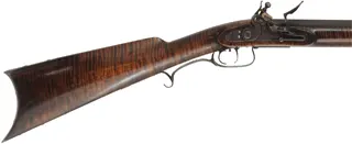 Tennessee Longrifle,
.50 caliber, 42" tapered barrel,
Siler flintlock, curly maple, iron trim,
used, signed by C.O. Jossens
