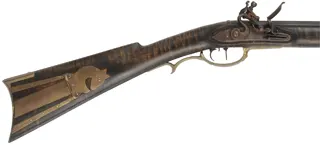Lancaster Co. Longrifle,
.50 caliber, 38-1/2" barrel,
L&R flintlock, curly maple, brass,
used, by L. Cardroy