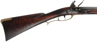 Colonial Longrifle,
.58 caliber,  43-1/2" swamped barrel, 
round faced flintlock, curly maple, brass,
new, unfired