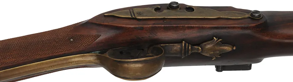 Left Hand New England Fowler, 
20 gauge turkey choke, 38" octagon to round barrel,
L&R Queen Anne flintlock, checkered cherry, brass 
used, marked B. Barrows