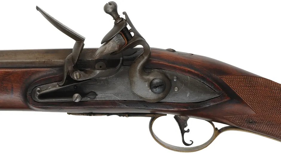 Left Hand New England Fowler, 
20 gauge turkey choke, 38" octagon to round barrel,
L&R Queen Anne flintlock, checkered cherry, brass 
used, marked B. Barrows
